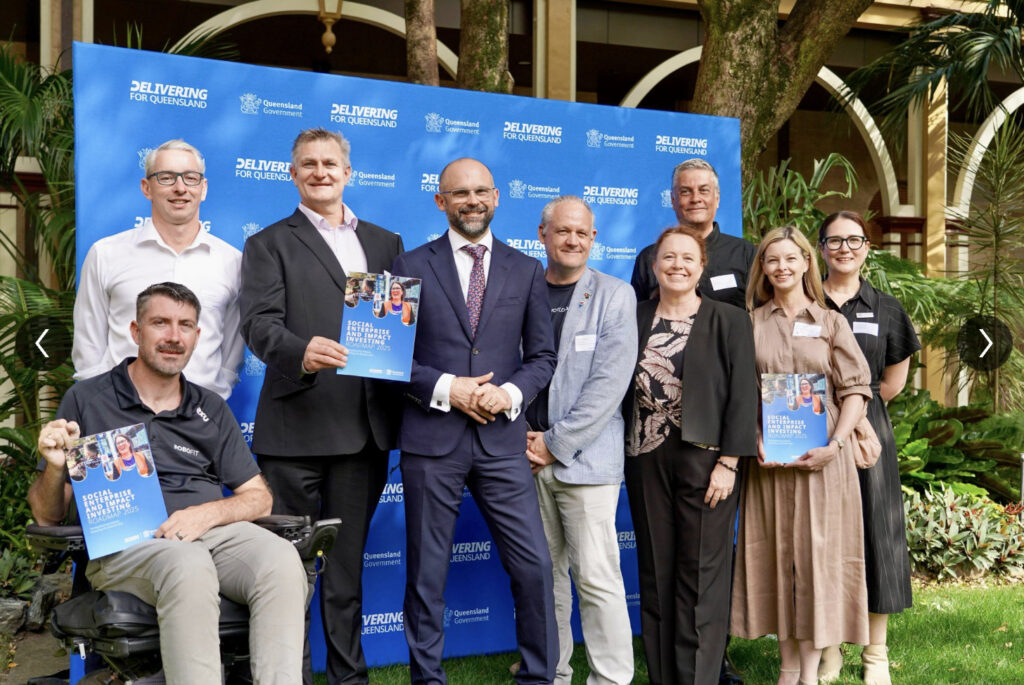 Government officials and peak body representatives standing together at Parliament House for the launch ofSocial Enterprise and Impact Investing Roadmap launch